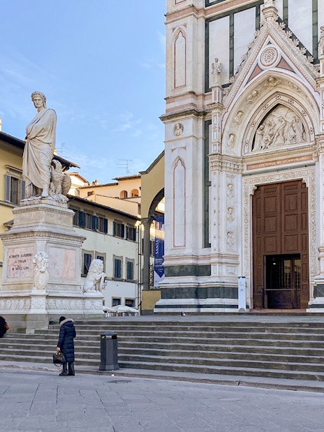 Santa Croce Basilica entrance and Dante statue in Florence, Italy.