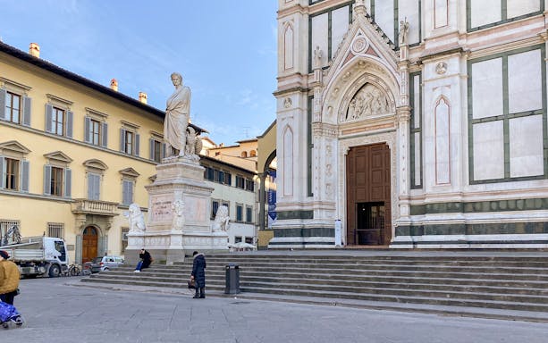 Santa Croce Basilica entrance and Dante statue in Florence, Italy.