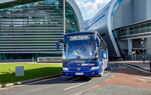 Dublin Express bus at Dublin Airport terminal.