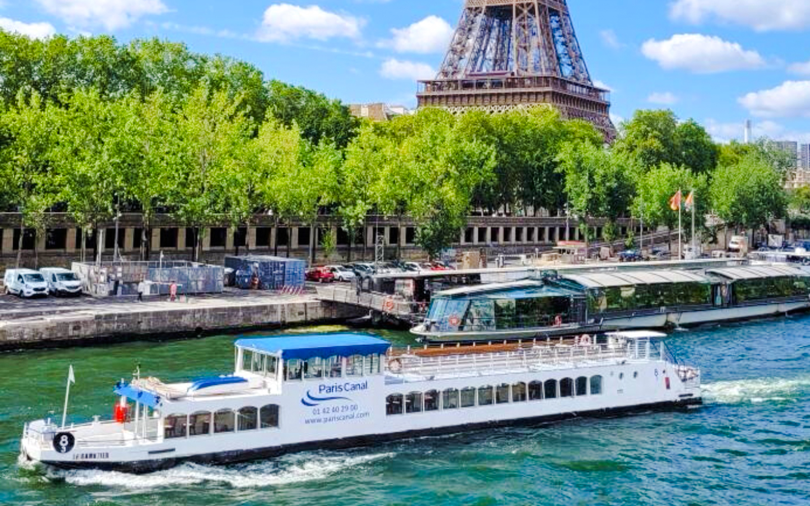 Paris Canal cruise boat near Eiffel Tower, France.