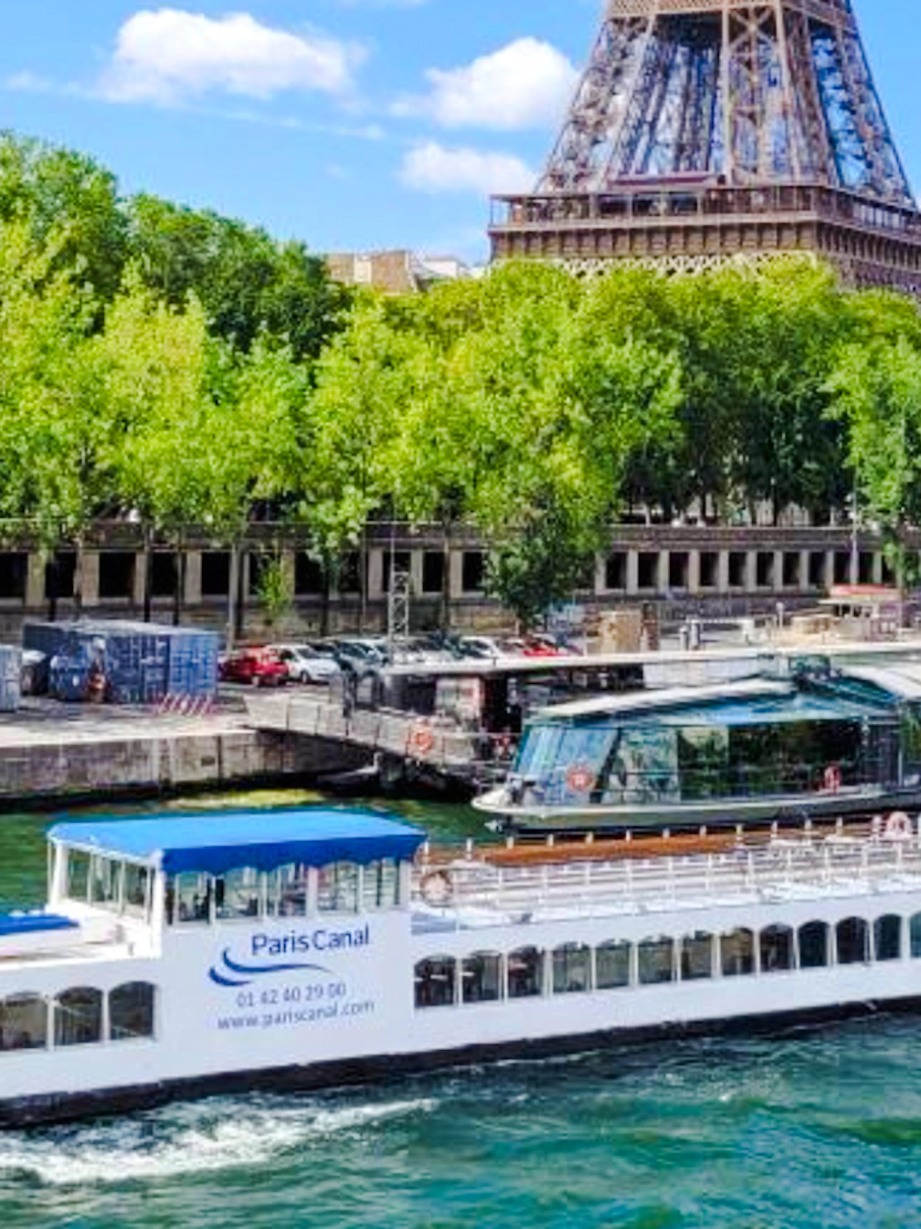 Paris Canal cruise boat near Eiffel Tower, France.