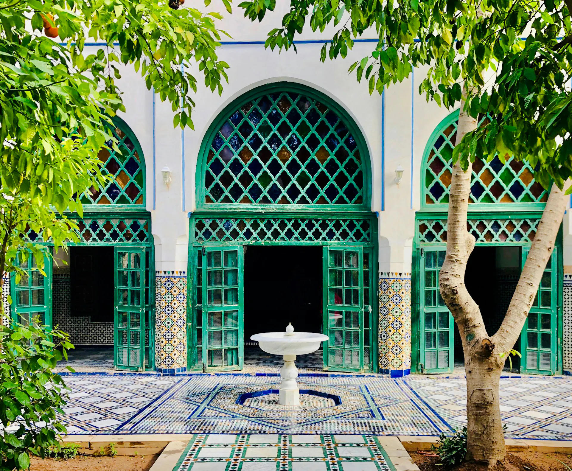 Moroccan architecture with green lattice windows in Casablanca.