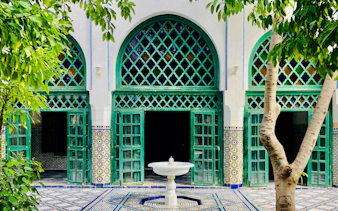 Moroccan architecture with green lattice windows in Casablanca.