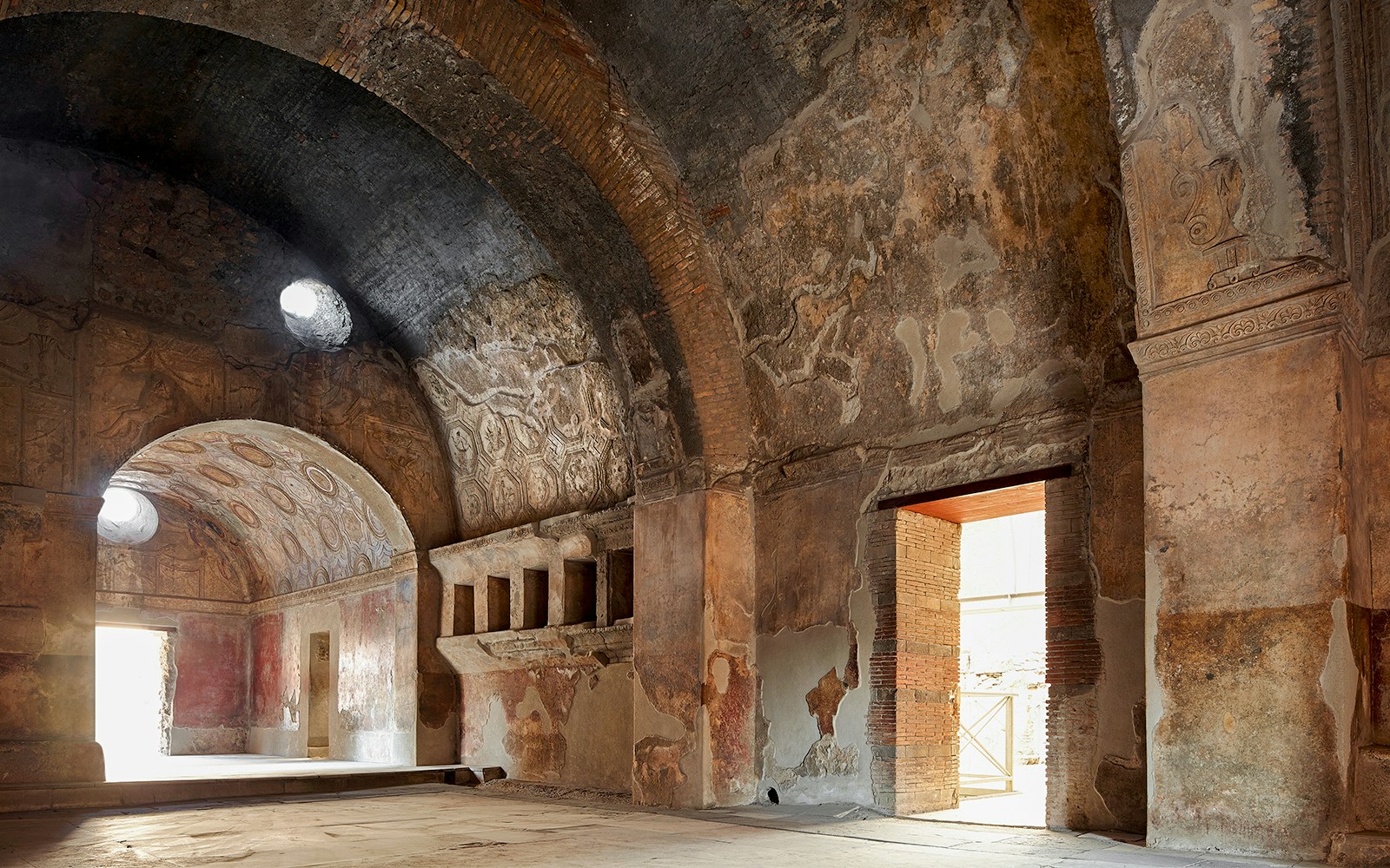 Pompeii Stabian Baths gymnasium with ancient columns and open courtyard.