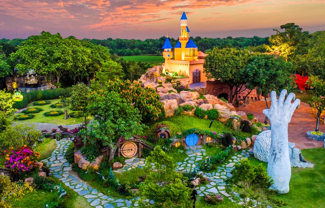 Fantasy-themed garden with castle and sculptures at Photopia, Dreamworld Bangkok.