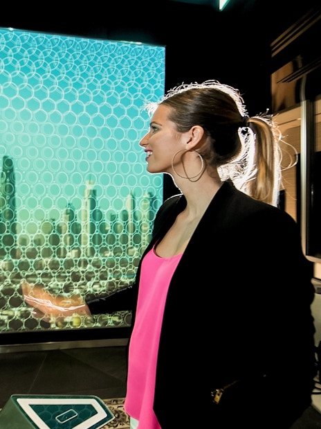 Visitors at Burj Khalifa's SKY level enjoying Dubai skyline views.
