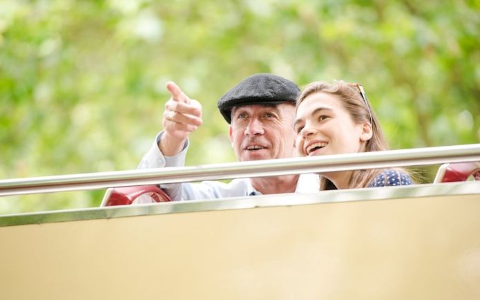 Family enjoying view from Big Bus hop on hop off tour.
