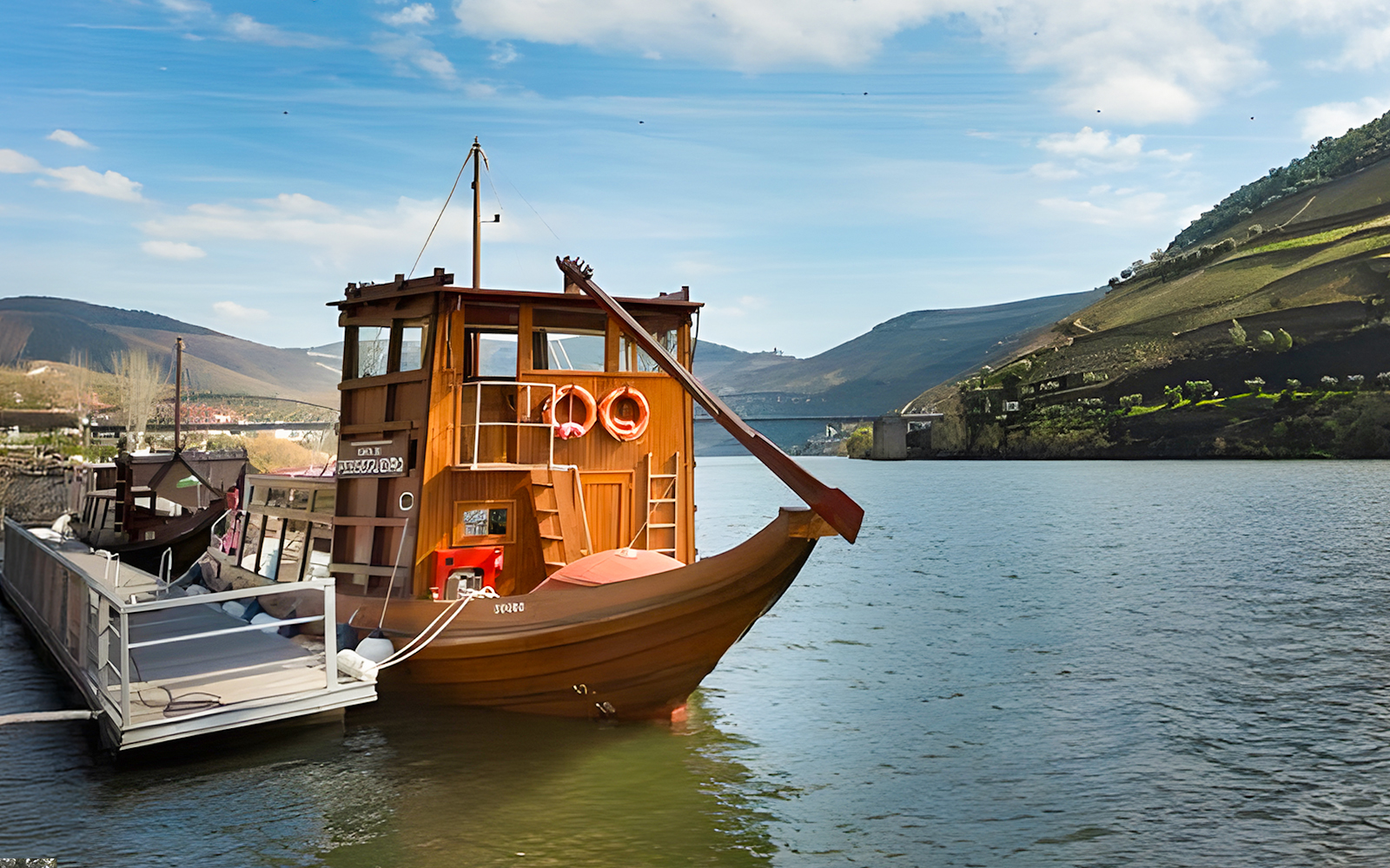 Boat on Douro River with vineyard hills in Douro Valley, Portugal.