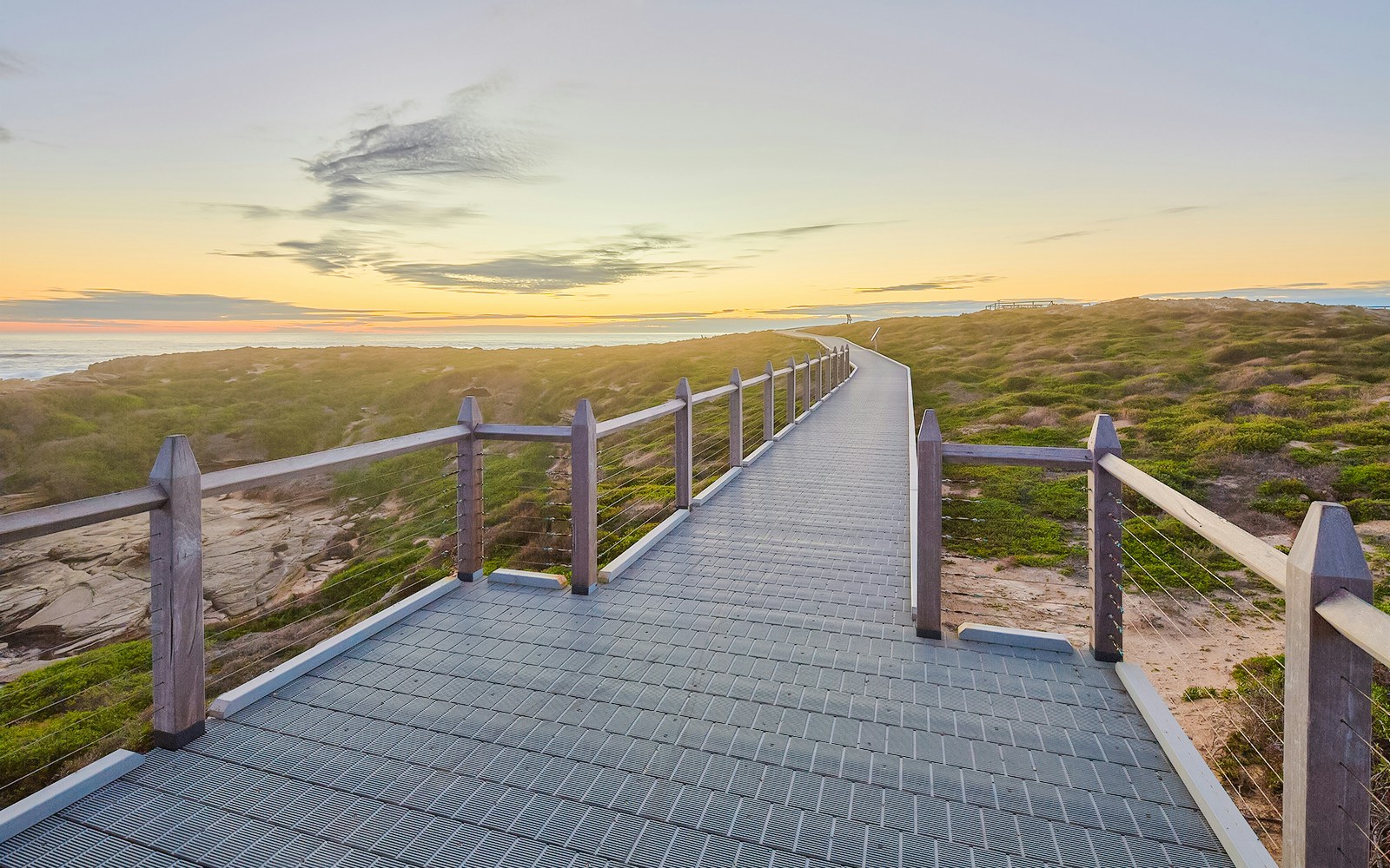 Walkway leading to lighthouse on Rottnest Island at sunset.