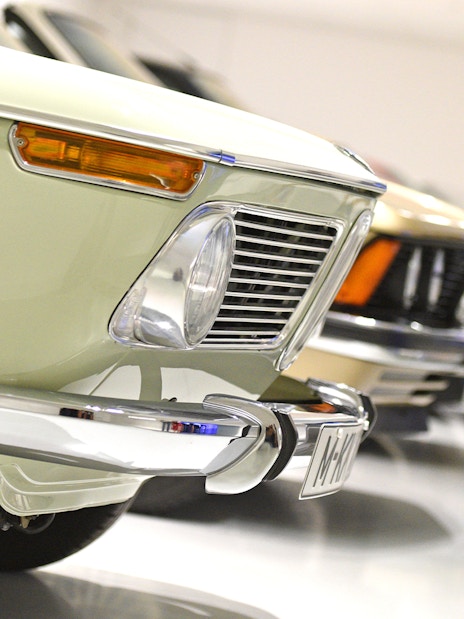 Closeup of vintage BMW cars on display at the BMW Museum.