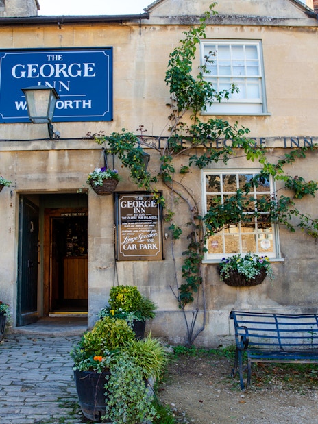 The George Inn entrance with hanging plants, Lacock.
