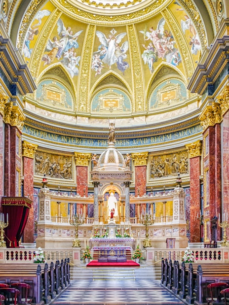 Interior view of St. Stephen's Basilica in Budapest, featuring ornate columns and a detailed altar.
