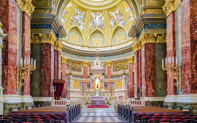 Interior view of St. Stephen's Basilica in Budapest, featuring ornate columns and a detailed altar.