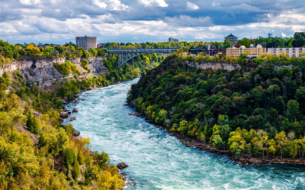 Niagara River flowing through Niagara Gorge with Whirlpool Rapids Bridge in the background.