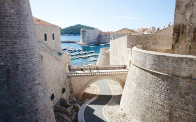 Stone bridge linking Revelin Fortress to Ploče Gate in Dubrovnik's Old Town.