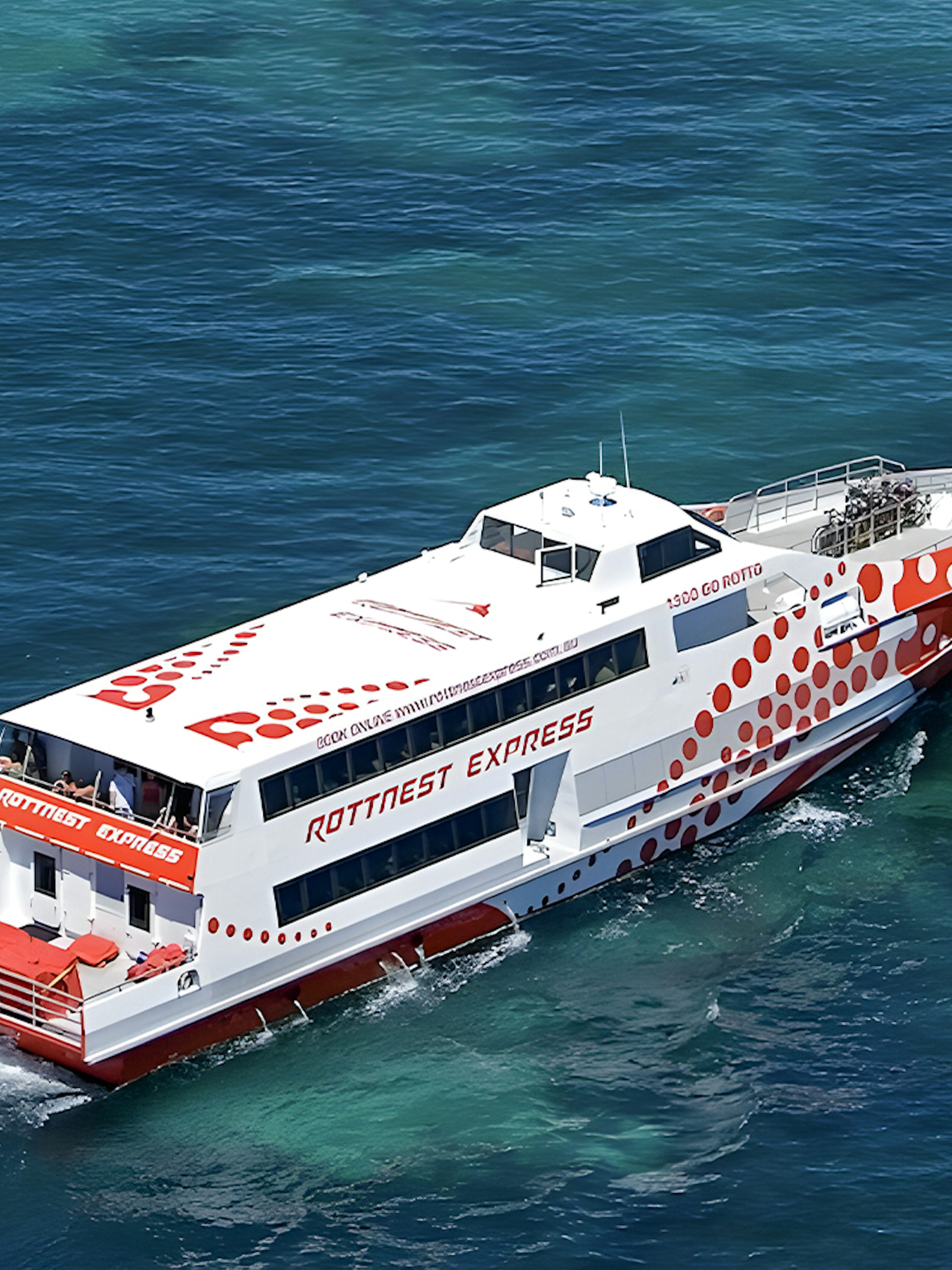 Ferry cruising on clear blue waters during Rottnest Island day trip from Fremantle.