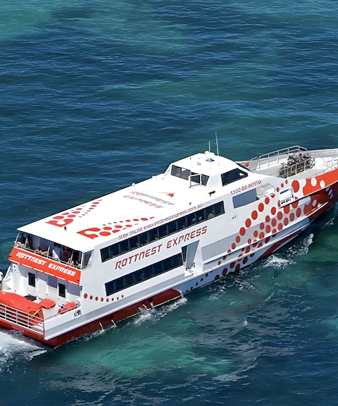 Ferry cruising on clear blue waters during Rottnest Island day trip from Fremantle.