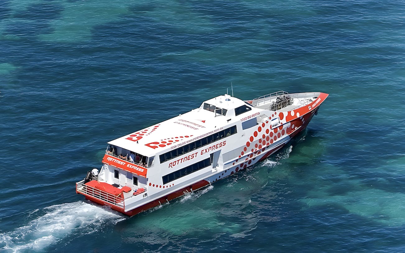 Ferry cruising on clear blue waters during Rottnest Island day trip from Fremantle.