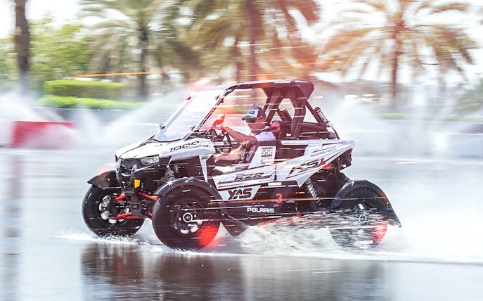 Polaris vehicle drifting on wet track at YAS Marina Circuit during Drift Sprint Experience.