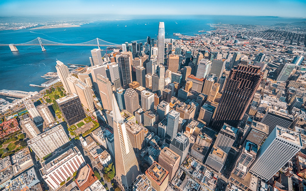 Aerial view of San Francisco skyline and Bay Bridge from helicopter ride.