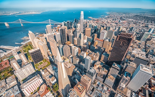 Aerial view of San Francisco skyline and Bay Bridge from helicopter ride.