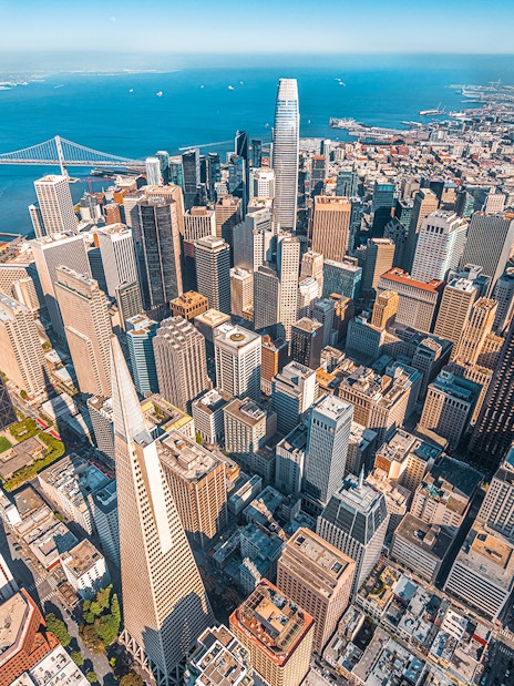 Aerial view of San Francisco skyline and Bay Bridge from helicopter ride.