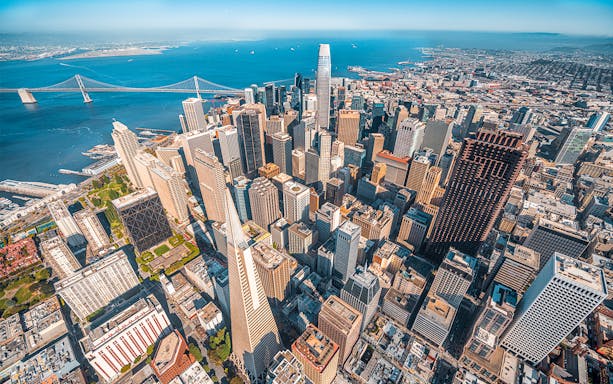 Aerial view of San Francisco skyline and Bay Bridge from helicopter ride.