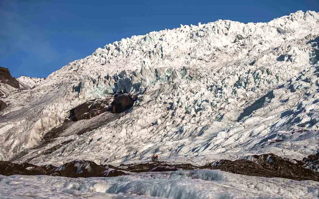 Vatnajökull Ice Cap with hikers exploring the glacier in Iceland.