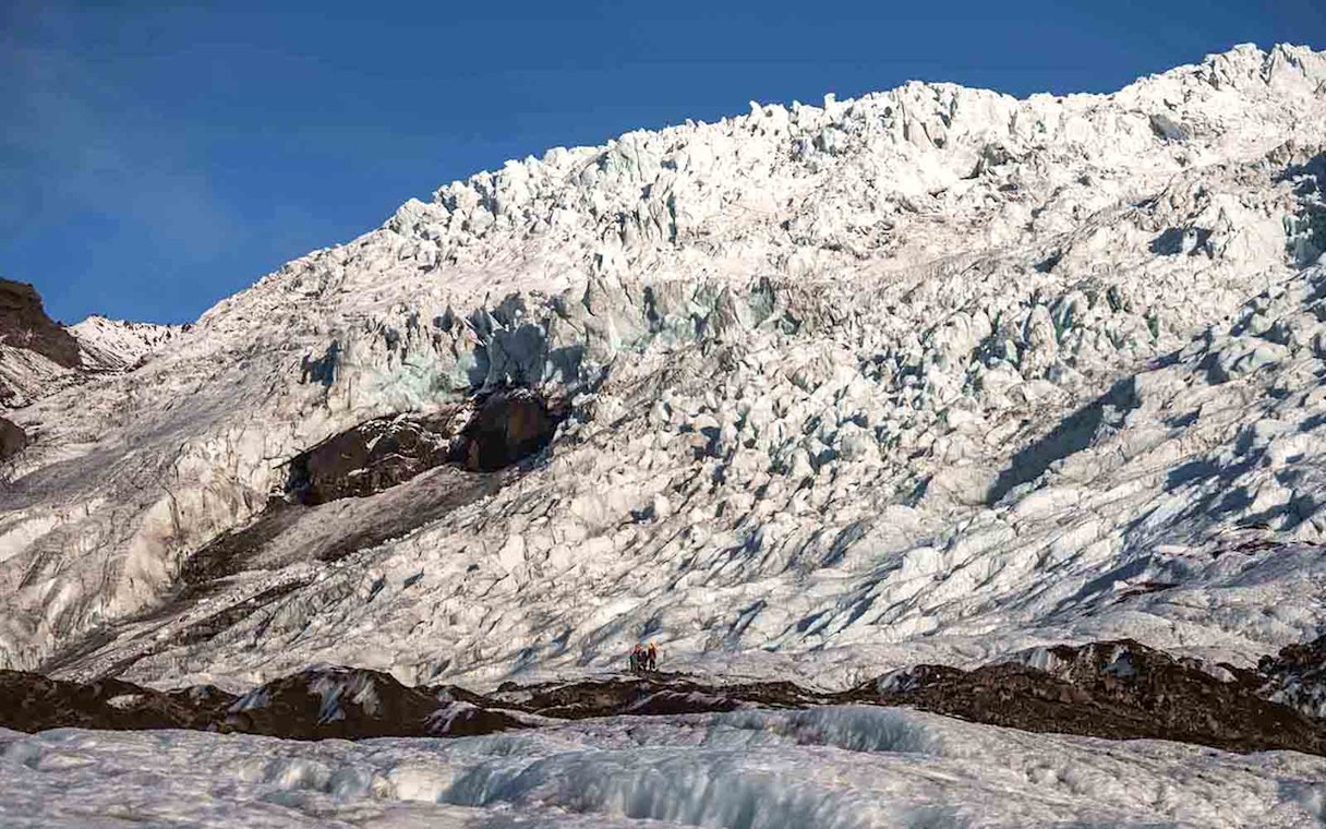 Vatnajökull Ice Cap with hikers exploring the glacier in Iceland.