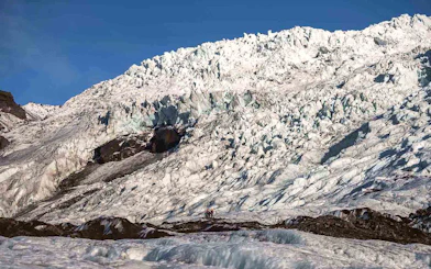 Vatnajökull Ice Cap with hikers exploring the glacier in Iceland.