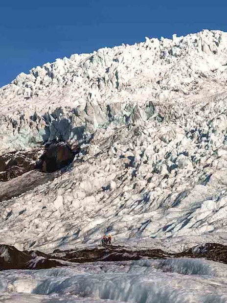 Vatnajökull Ice Cap with hikers exploring the glacier in Iceland.