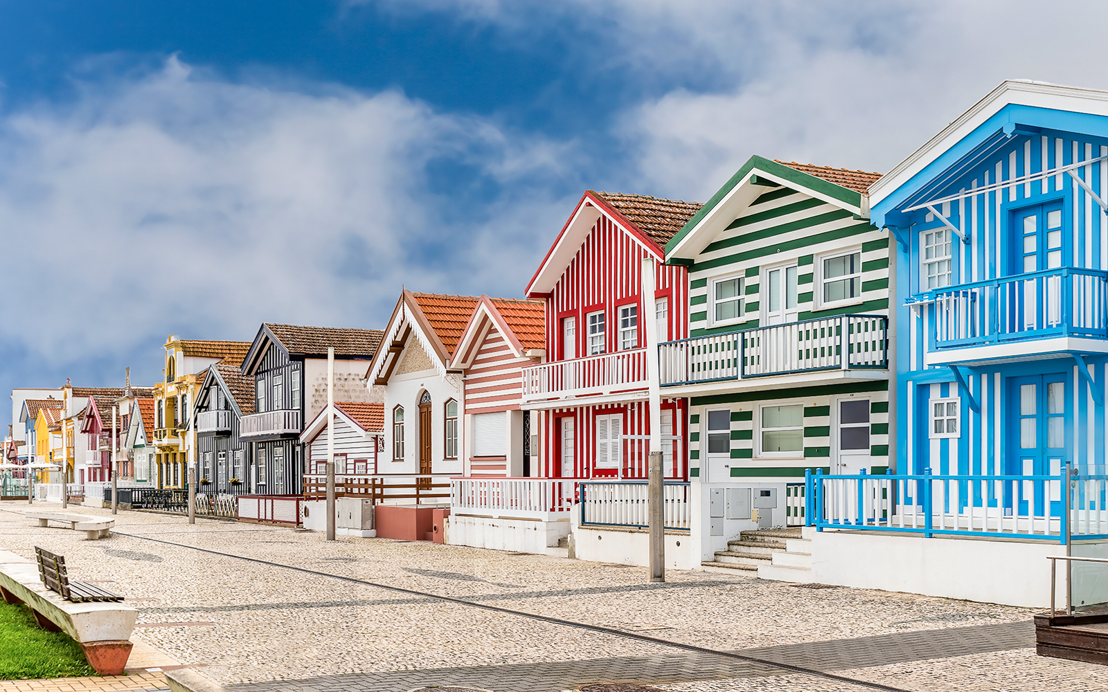 Colorful striped houses in Costa Nova, Aveiro, Portugal, seen on a guided tour.