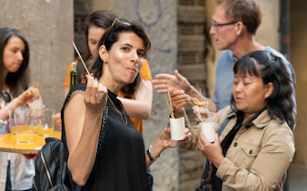 Group enjoying pintxos on a food tour in Bilbao, Spain.
