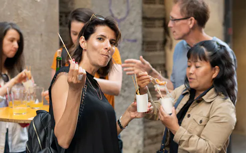 Group enjoying pintxos on a food tour in Bilbao, Spain.