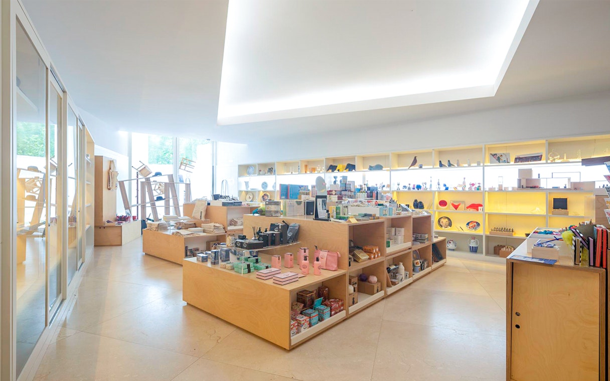 Gift shop interior at Serralves Foundation, Porto, displaying various souvenirs and art items.