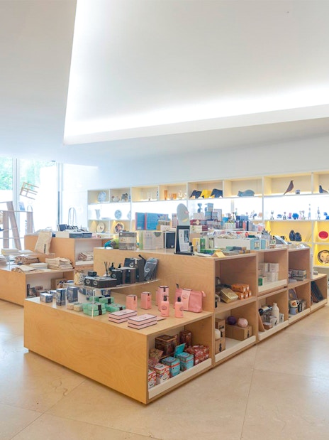 Gift shop interior at Serralves Foundation, Porto, displaying various souvenirs and art items.