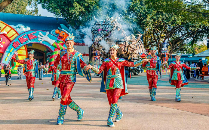 Performers in colorful costumes at Chimelong Paradise theme park.