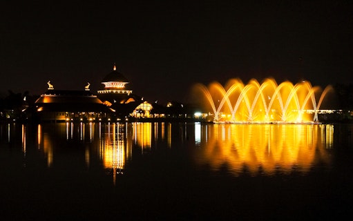 Musical fountain show at Chiang Mai Night Safari with illuminated water arcs.