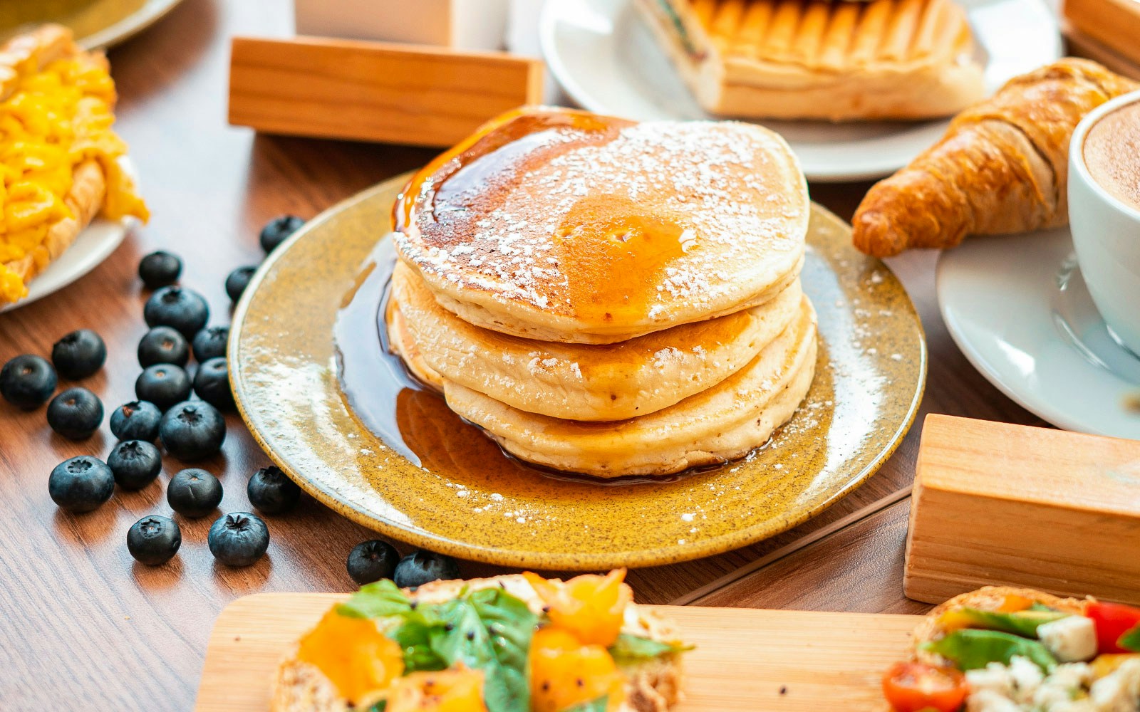 Pancake breakfast served on a terrace overlooking the Eiffel Tower in Paris, France.