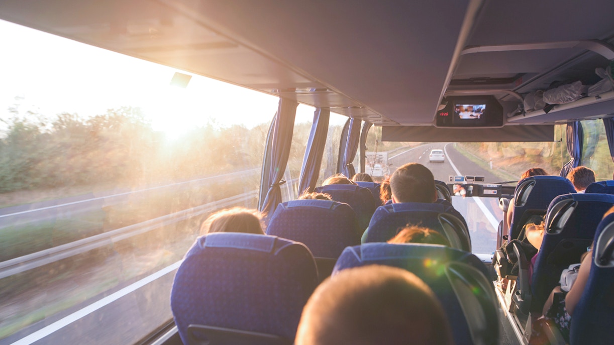 Bus interior with passengers traveling from Shinjuku to Tokyo Disney Resort.
