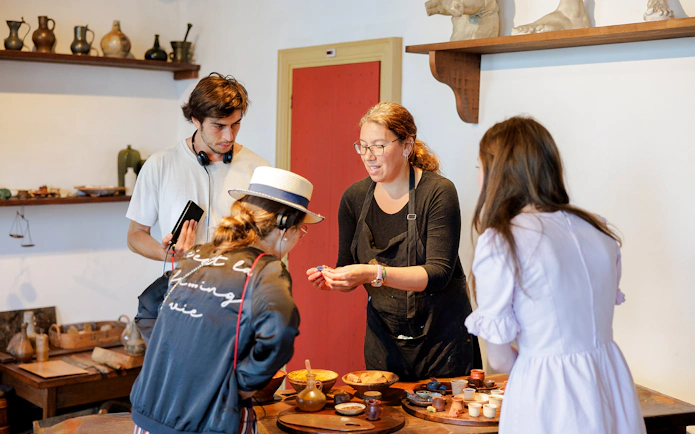 Visitors engaging in a hands-on activity at Rembrandt House Museum, Amsterdam.