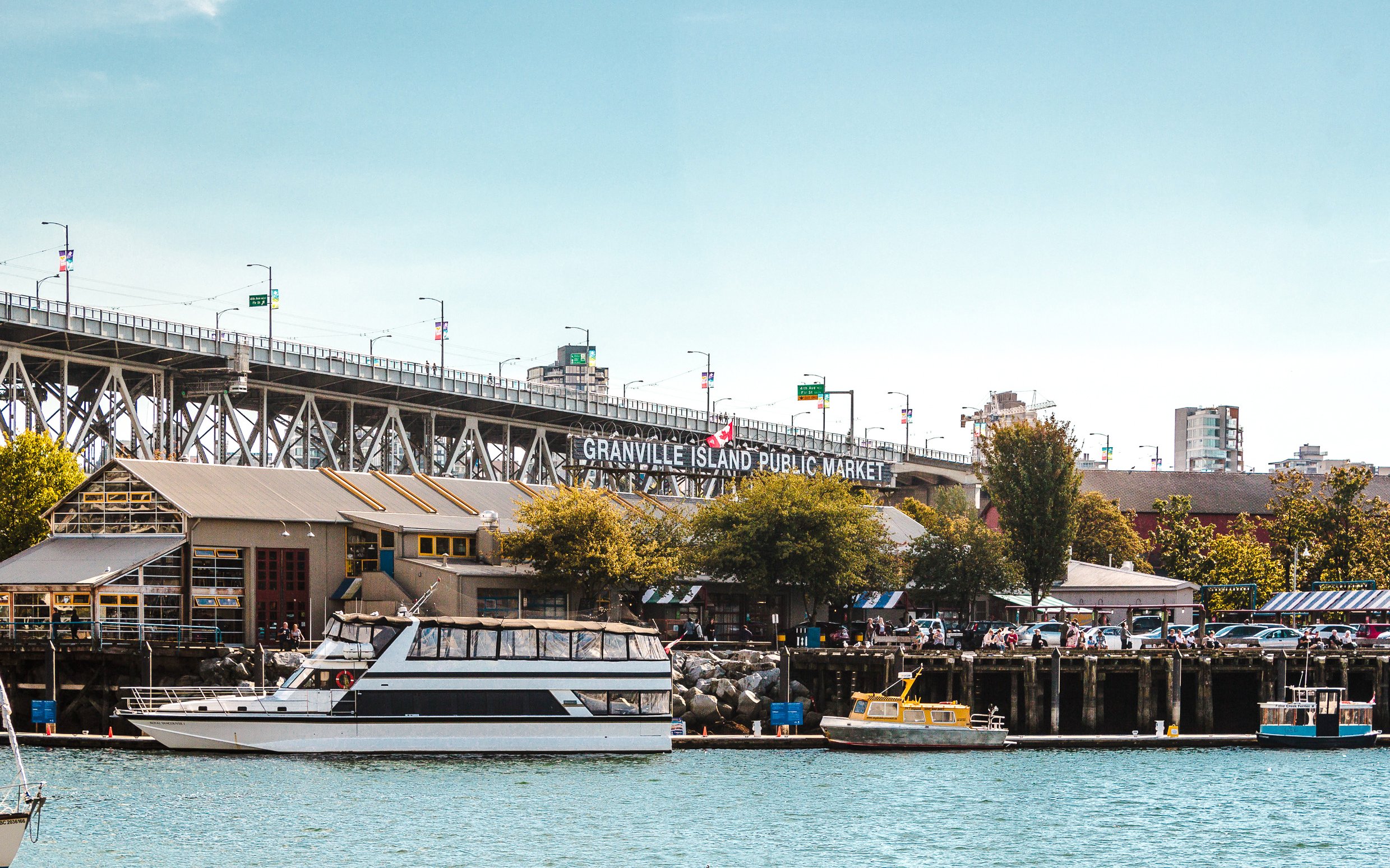 Granville Island Public Market with boats docked in Vancouver, Canada.