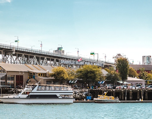 Granville Island Public Market with boats docked in Vancouver, Canada.