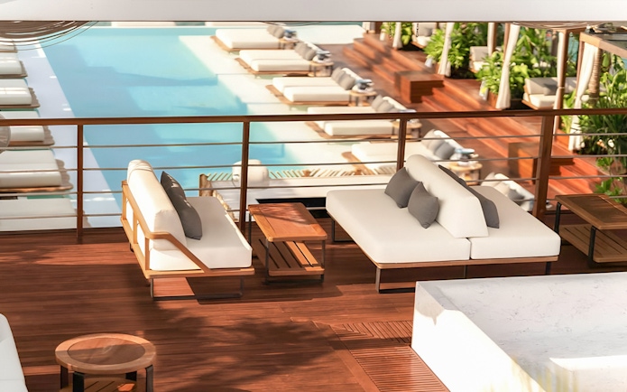 Sunset terrace with poolside lounge at Yona Beach Club, Phuket.