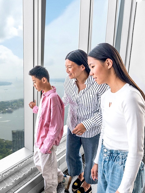 Visitors enjoying New York skyline view from One World Observatory.