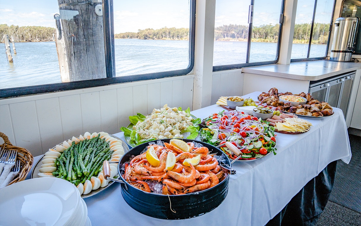 Lunch buffet with seafood, salads, and meats on a Murray River cruise.