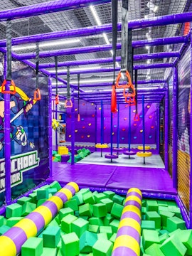 Indoor playground with climbing structures and foam pit in Singapore.