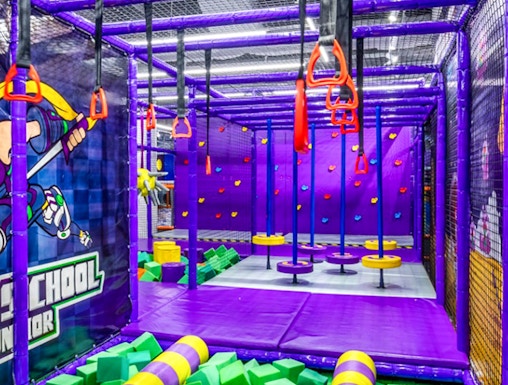 Indoor playground with climbing structures and foam pit in Singapore.