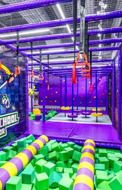 Indoor playground with climbing structures and foam pit in Singapore.