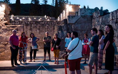Group of tourists on a guided night tour at Medina Azahara, Córdoba.